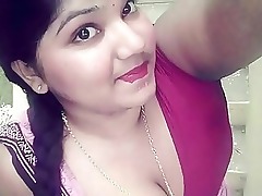 Tamil beauty indulges in steamy pleasure, captivating viewers with her irresistible charm.