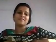 Naive Desi teen films herself fondling her breasts in a solo session, sharing the intimate moment with you.