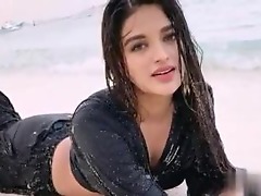 Nidhhi Agerwal seductively undresses, her body heating up in anticipation.