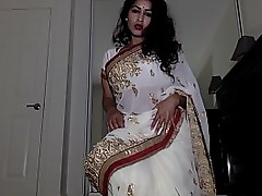Sultry Auntie strips down her traditional Indian clothes to reveal her intimate desires.