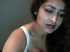 Desi beauty Maya teases and pleases on webcam with skilled hands and sensuality.